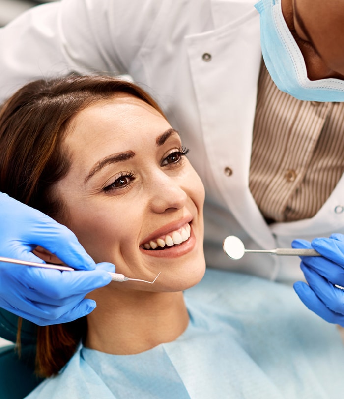 Dentist cleaning a patient's teeth